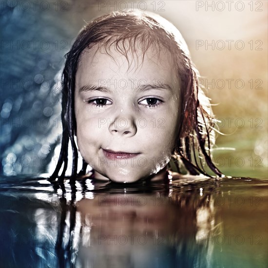 Caucasian girl swimming in water
