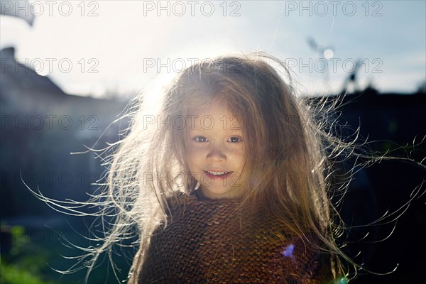 Caucasian girl with messy hair outdoors