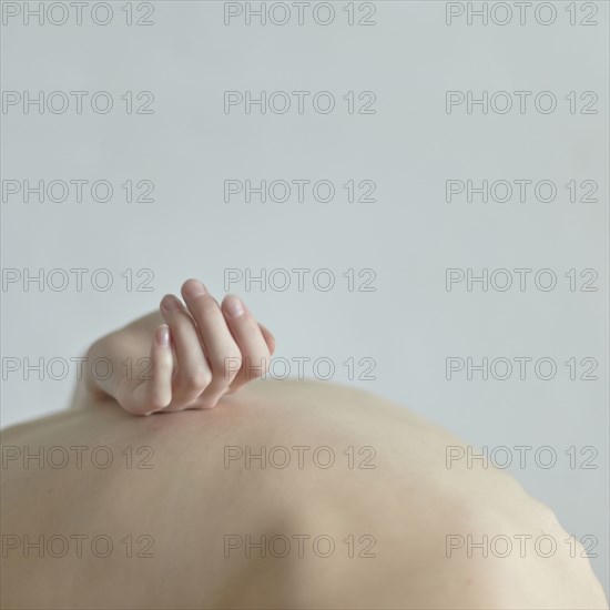 Caucasian woman holding pregnant belly