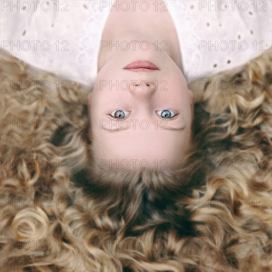 Caucasian girl laying on ground