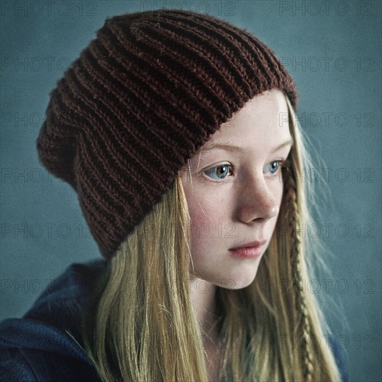 Teenage girl wearing knitted cap