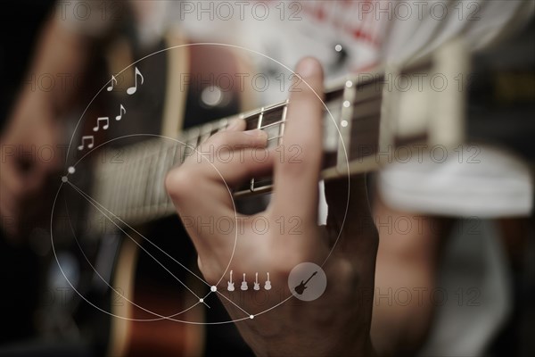 Caucasian man playing guitar overlaid with graphic design