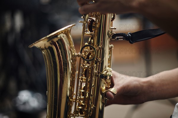 Close up of Caucasian man playing saxophone