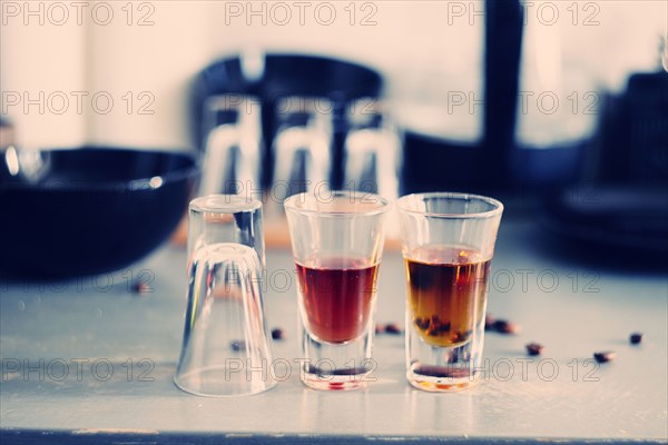 Close up of shot glasses on table