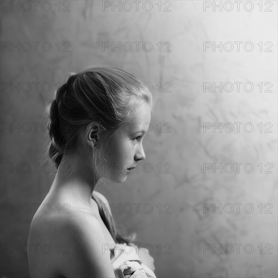 Profile of Caucasian girl with braided hair