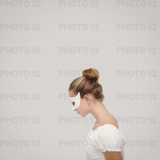 Caucasian girl wearing white mask