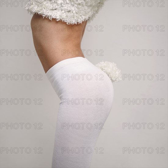 Midsection of Caucasian girl wearing rabbit costume