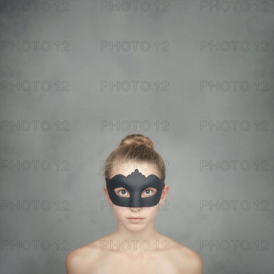 Caucasian girl wearing black mask