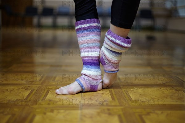 Caucasian dancer wearing leg warmers