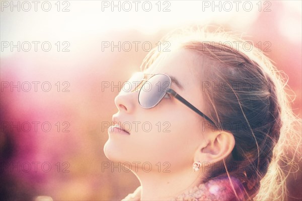 Caucasian teenage girl wearing sunglasses