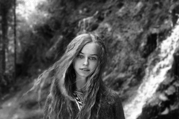 Caucasian teenage girl in forest