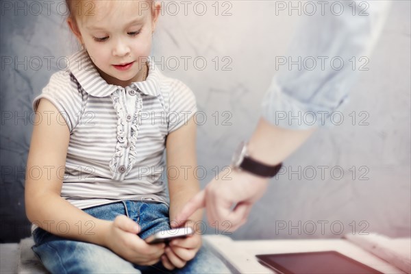 Caucasian father and daughter using digital tablet