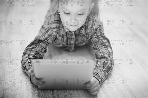 Caucasian girl using digital tablet