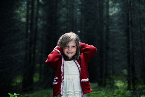 Caucasian girl smiling in forest