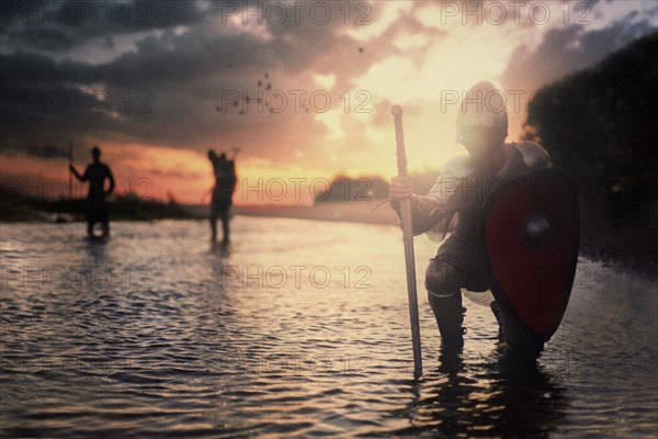 Caucasian soldiers standing in river