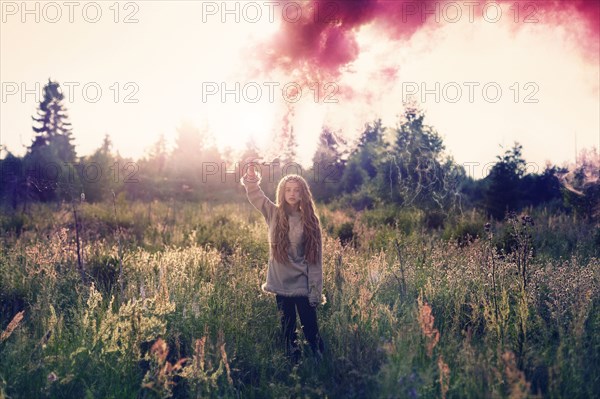 Caucasian teenage girl spraying pigment powder