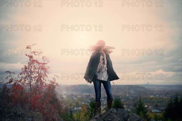 Caucasian girl standing on hilltop