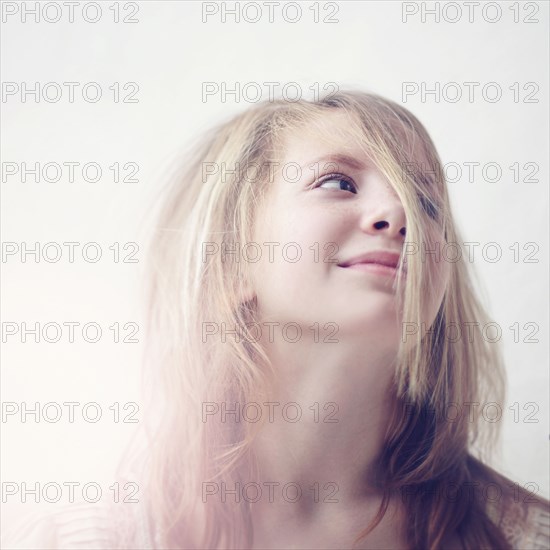 Caucasian teenage girl looking up