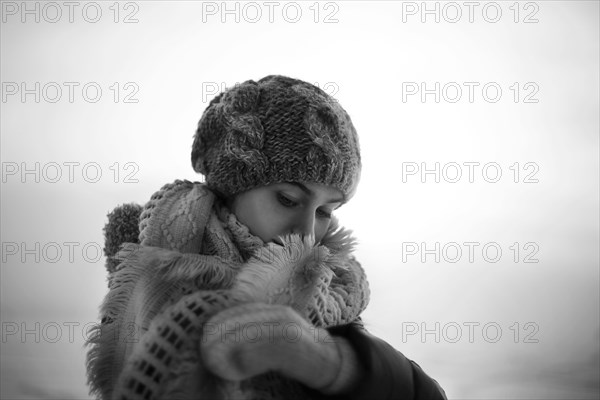 Caucasian teenage girl wearing scarf outdoors