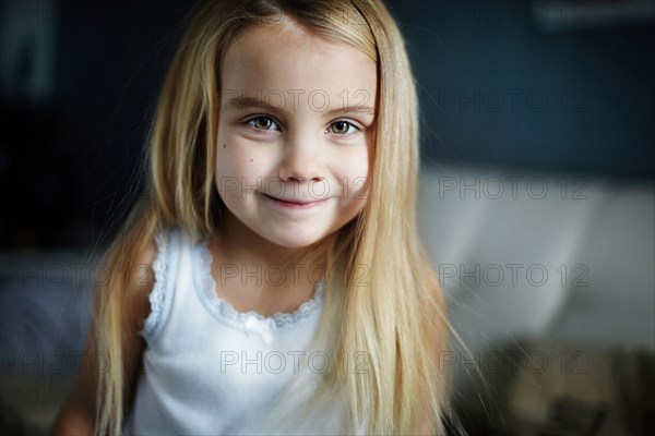 Caucasian girl smiling indoors