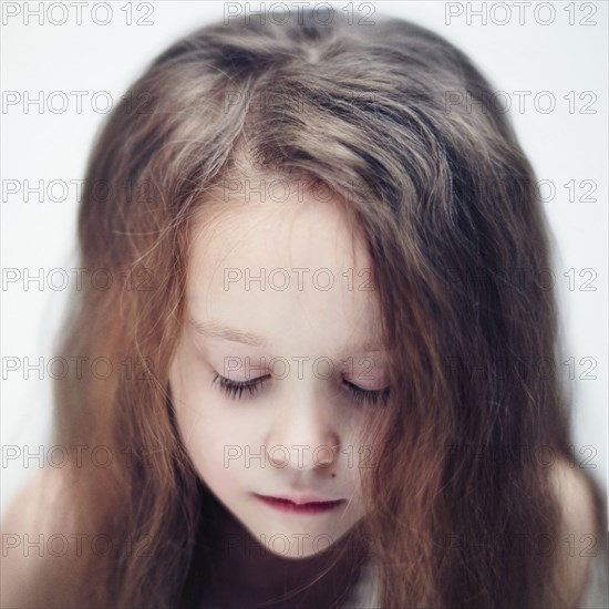 Close up of Caucasian girl with eyes closed