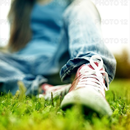 Close up of Caucasian woman wearing sneakers