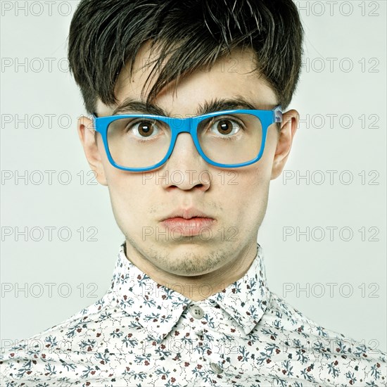 Caucasian man wearing colorful eyeglasses