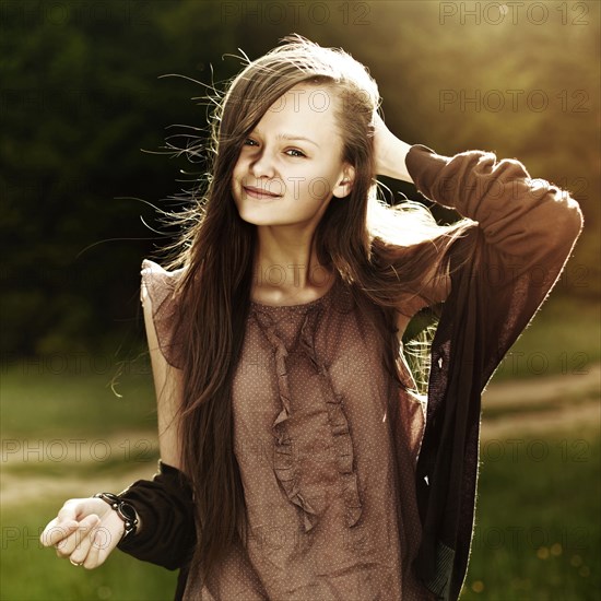 Caucasian woman smiling in field