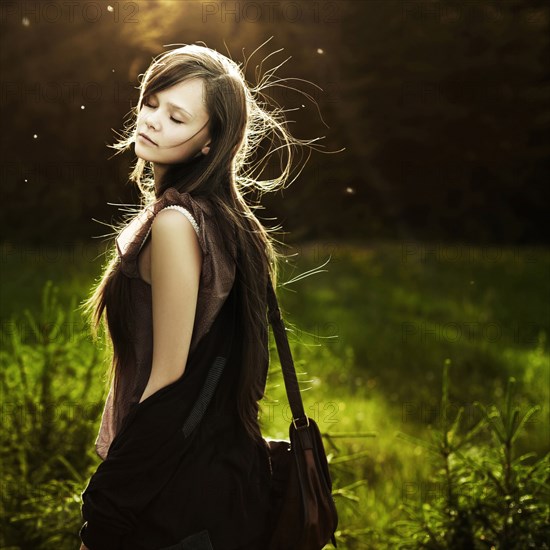 Caucasian woman walking in field