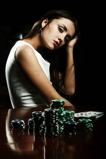 Caucasian woman playing poker