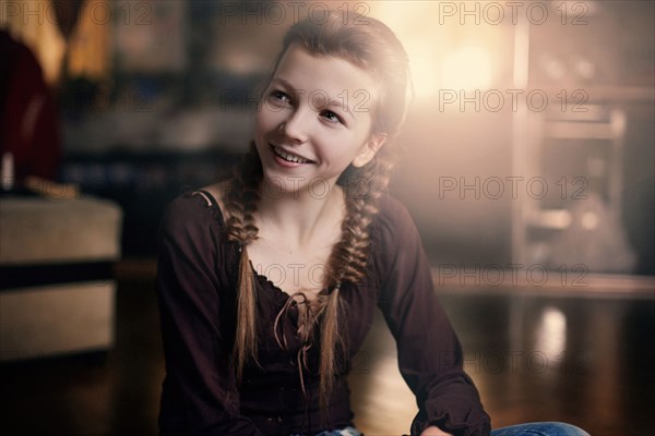 Caucasian teenage girl smiling indoors