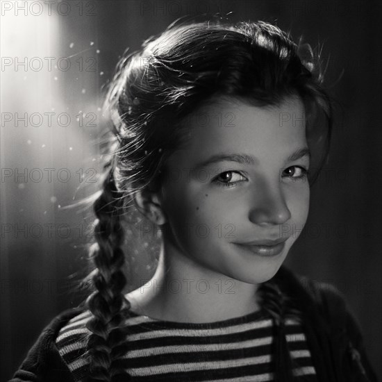 Caucasian teenage girl wearing braids