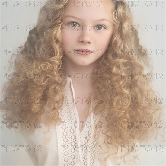 Caucasian teenage girl with curly hair