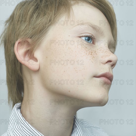 Close up of Caucasian boy with freckles