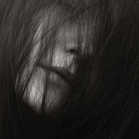 Close up of Caucasian woman with messy hair