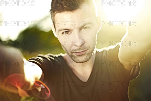 Caucasian man taking selfie outdoors