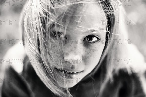 Hair of Caucasian girl with braces blowing in wind