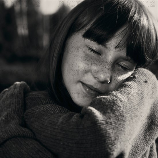 Portrait of smiling Caucasian girl wearing sweater