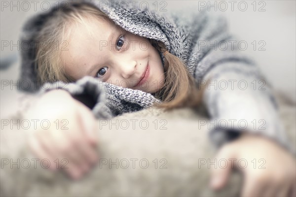 Portrait of smiling Caucasian girl wearing sweater