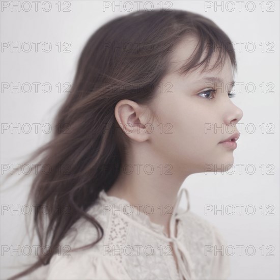 Wind blowing hair of Caucasian girl