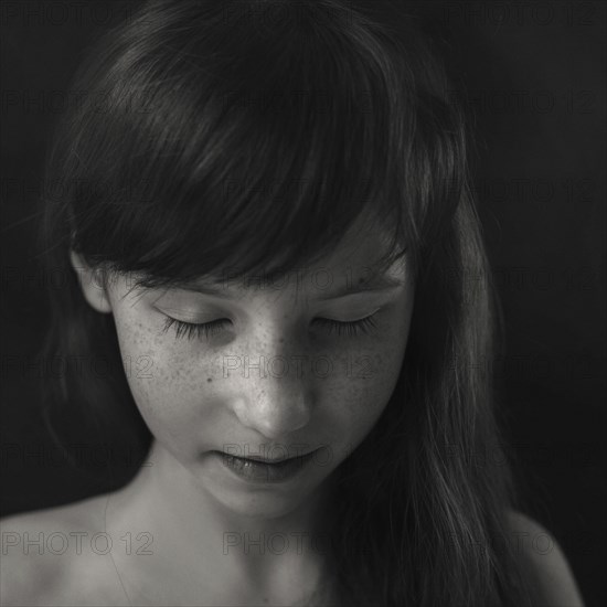 Portrait of Caucasian girl looking down