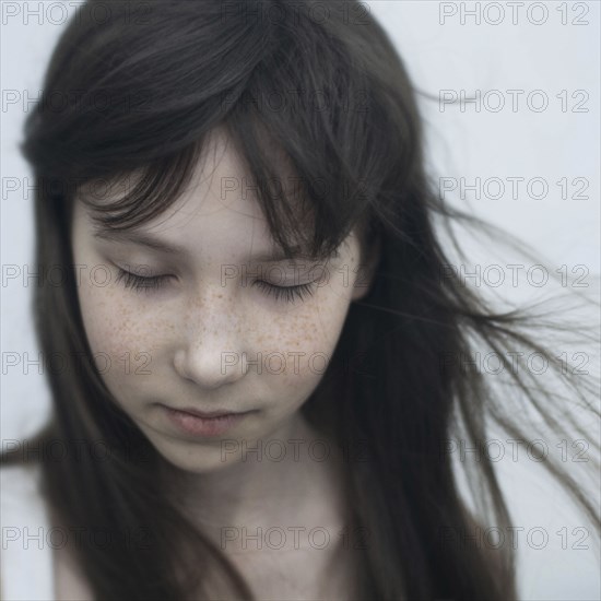 Wind blowing hair of Caucasian girl