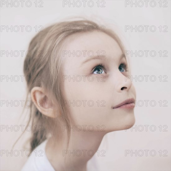 Close up of smiling Caucasian girl looking up