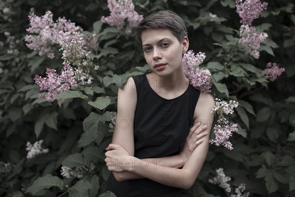 Caucasian woman standing in flowers