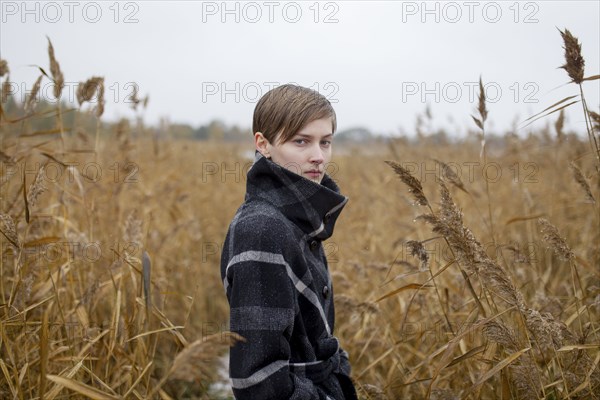 Portrait of serious Caucasian woman standing in field