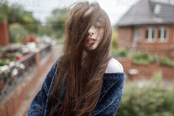 Wind blowing hair of Caucasian girl