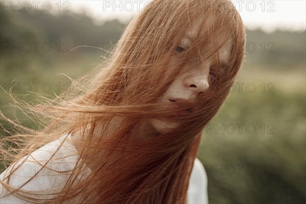 Close up of wind blowing hair of Caucasian woman