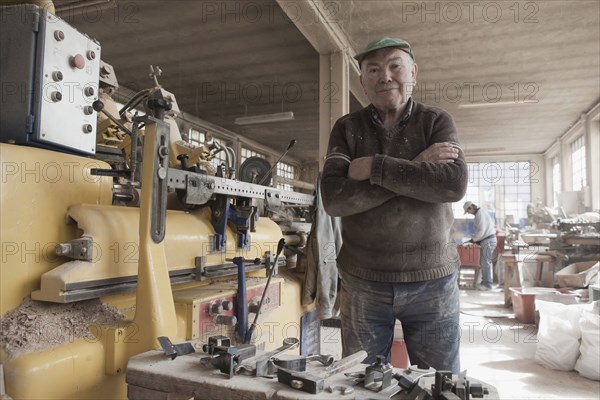 Carpenter working in woodshop