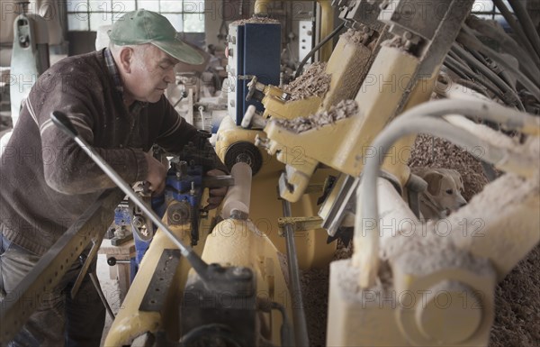 Carpenter working in woodshop