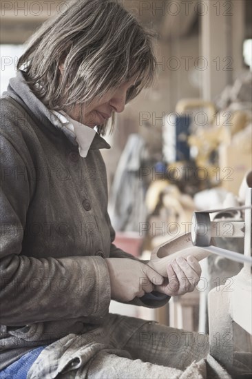 Carpenter working in woodshop